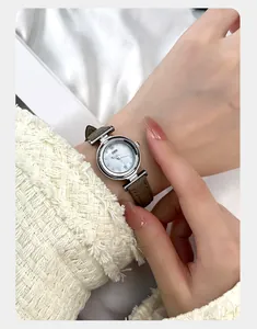 Detail of GEDI women's watch featuring a blue mother-of-pearl dial and brown leather strap