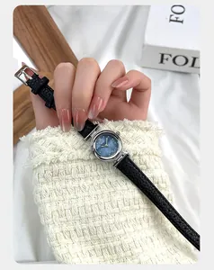 Detail of GEDI quartz watch with blue mother-of-pearl dial and black leather strap