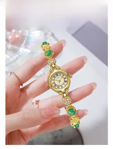 Macro view of GEDI vintage gold watch with green agate beads and jewelry strap detail
