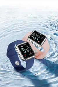 Close-up of GEDI waterproof digital sports watches with blue and pink silicone straps in water