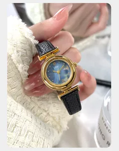 Macro shot of GEDI women's watch with blue mother of pearl dial and black leather strap