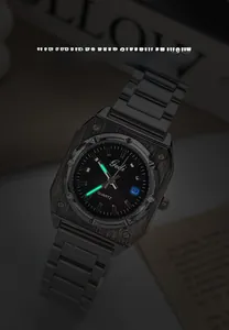 Macro shot of Gedi quartz watch showing luminous hands and green glow in the dark