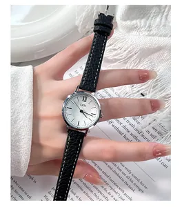 Close-up of elegant GEDI women's watch featuring a black leather strap and silver dial