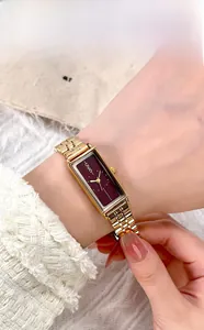 Macro shot of GEDI vintage rectangular watch with burgundy dial and gold mesh steel strap