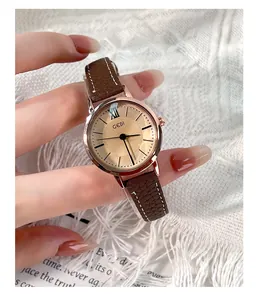 Close-up of GEDI vintage women's watch with rose gold case and brown leather strap