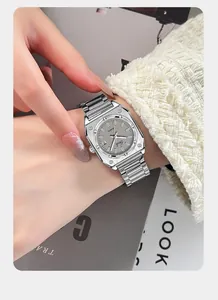 Macro view of Gedi square silver steel watch with date window and geometric bezel
