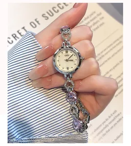 Detail of GEDI bracelet watch featuring pink heart crystals and silver diamond accents