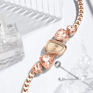 GEDI rose gold fashion watch with pink triangular crystals and an irregular dial design