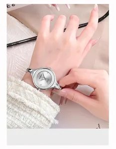 Close-up of minimalist silver quartz watch with sleek metal strap worn on a wrist