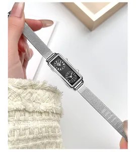 Detailed close-up of a silver dual-dial rectangular quartz watch with mesh strap