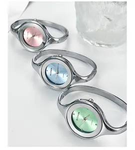 Minimalist quartz bangle watches with pink, light blue and green dials in silver finish