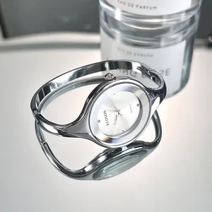 Silver minimalist bangle watch for women with polished round dial and quartz movement