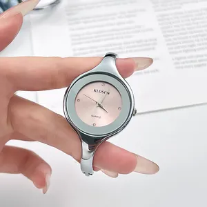 Elegant silver bangle watch with a pink dial and quartz movement for women