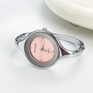 Elegant silver bangle watch for women with pink dial and minimalist crystal markers