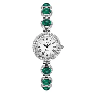 Montre à quartz GEDI luxe pour femme avec bracelet en métal argenté et pierres vertes
