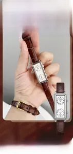 Detail view of vintage rectangular dual-dial quartz watch with brown leather strap