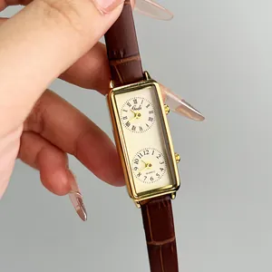 Gedi dual-timezone quartz watch with rectangular gold case and brown leather strap