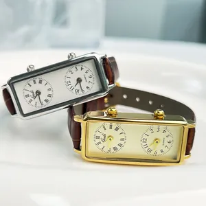 Gedi dual timezone rectangular quartz watch with silver and gold cases on brown leather
