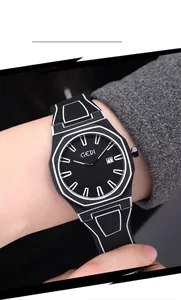 Close-up of black octagonal quartz watch with white geometric lines and date display