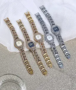 Close-up of luxury Cuban chain watches with crystal pavé bezels and sparkling rhinestones