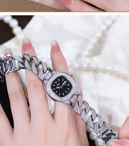 Close-up of Gedi luxury women's watch with rhinestone-encrusted silver chain and black dial