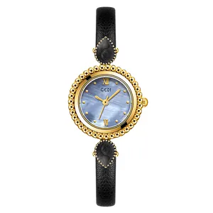 Montre dorée GEDI élégante avec cadran nacre bleue et bracelet en cuir noir