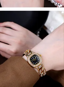 Close-up of Gedi luxury gold watch with rhinestone-encrusted square dial on wrist