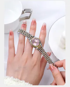 Detailaufnahme der GEDI Damenuhr mit rosa Zifferblatt und gold-silbernem Gliederarmband