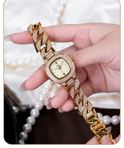 Macro view of gold luxury watch dial with cubic zirconia cuban link strap