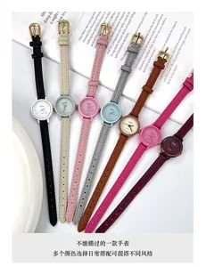 Detail view of colorful slim leather straps and round quartz watch dials in various colors