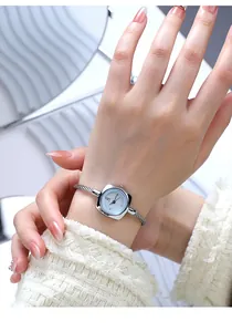 Close-up of GEDI women's silver braided rope bracelet watch with light blue square dial