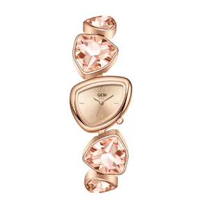 Women's rose gold luxury watch with irregular pink crystal triangular bracelet strap