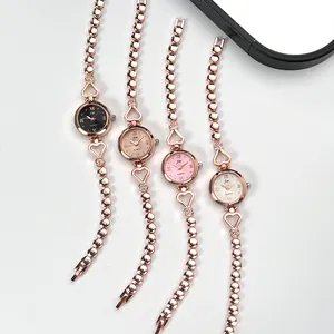 Detail of rose gold heart bracelets watches with colorful dials and crystal accents