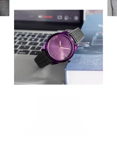 Macro detail of purple dial with gold hands and textured black silicone watch strap