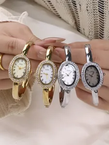 Makro-Detail der GEDI Oval-Armreif-Uhr mit diamantbesetzter Lünette und römischen Ziffern