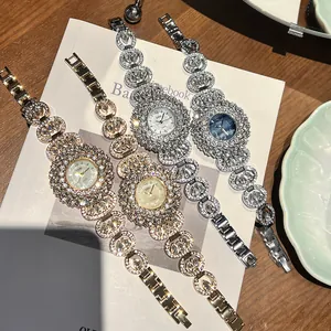 Elegante GEDI dameshorloges met strassteentjes en florale opengewerkte armbanden set