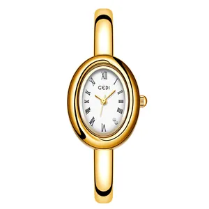 Reloj de brazalete dorado vintage para mujer con esfera blanca ovalada y números romanos