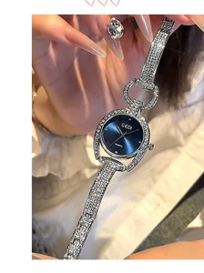 Macro detail of GEDI women watch with silver rhinestone band and blue sunray dial