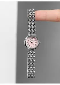 Macro view of GEDI mini silver steel watch with pink dial and Roman numerals