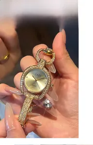 Close-up of GEDI ladies luxury watch with sparkling crystals and golden star dial detail