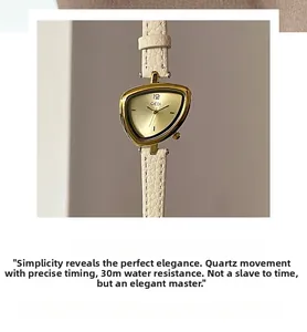 Detailed view of GEDI triangle gold watch with ivory leather strap and quartz movement