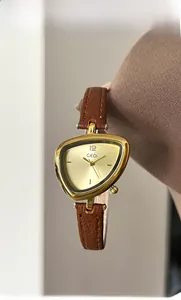 Close-up of a ladies' triangular quartz watch with golden case and brown leather strap