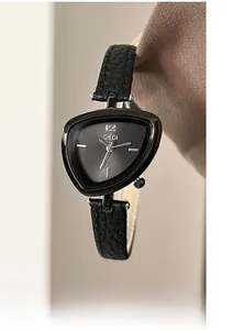 Macro shot of minimalist black triangular watch dial with GEDI logo and leather strap