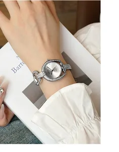 Close-up of elegant GEDI women watch with silver rhinestone bracelet and quartz movement