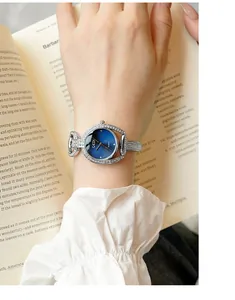 Detail of luxury GEDI watch featuring silver rhinestone bracelet and gradient blue dial