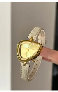 Detail view of GEDI triangle watch with sunburst dial and white leather strap