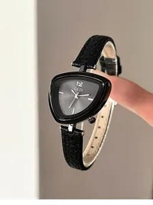 Macro shot of a triangular quartz watch with black litchi pattern leather strap detail