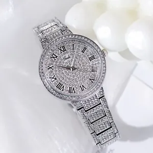 Close-up of luxury silver women's watch with shimmering crystals and Roman numerals
