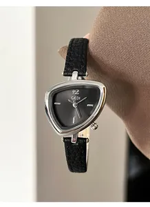 Detail of GEDI triangular watch featuring silver metal case and black leather strap