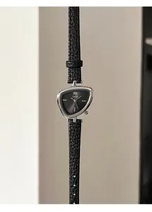 Detail of GEDI women's watch with triangular silver case and black leather strap